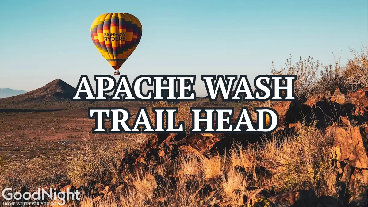 A breathtaking landscape featuring a hot air balloon rising above rugged mountain terrain, with sweeping views of the surrounding area. The scene captures the spirit of outdoor adventure, with visible hiking trails winding through rocky outcrops and picturesque vistas stretching to the horizon.
